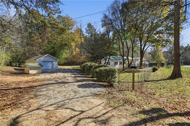 a view of a park with large trees