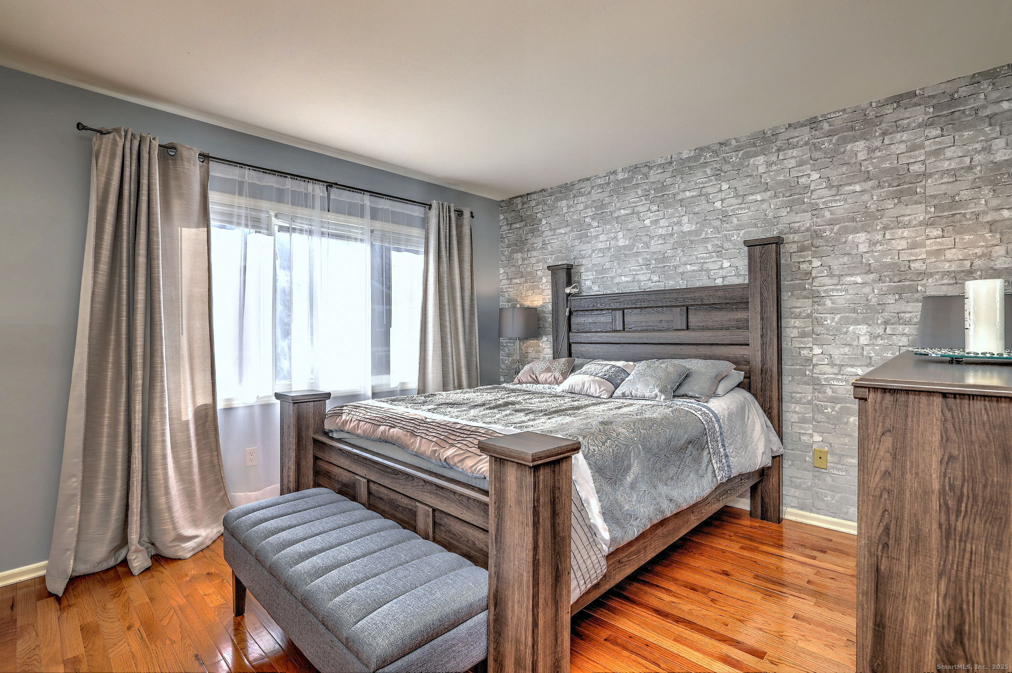 2838 Whitney Avenue, Unit 2 Hamden, CT 06518 - Photo 13 of 26 Spacious primary bedroom with a tactful full bathroom and generous closet space.