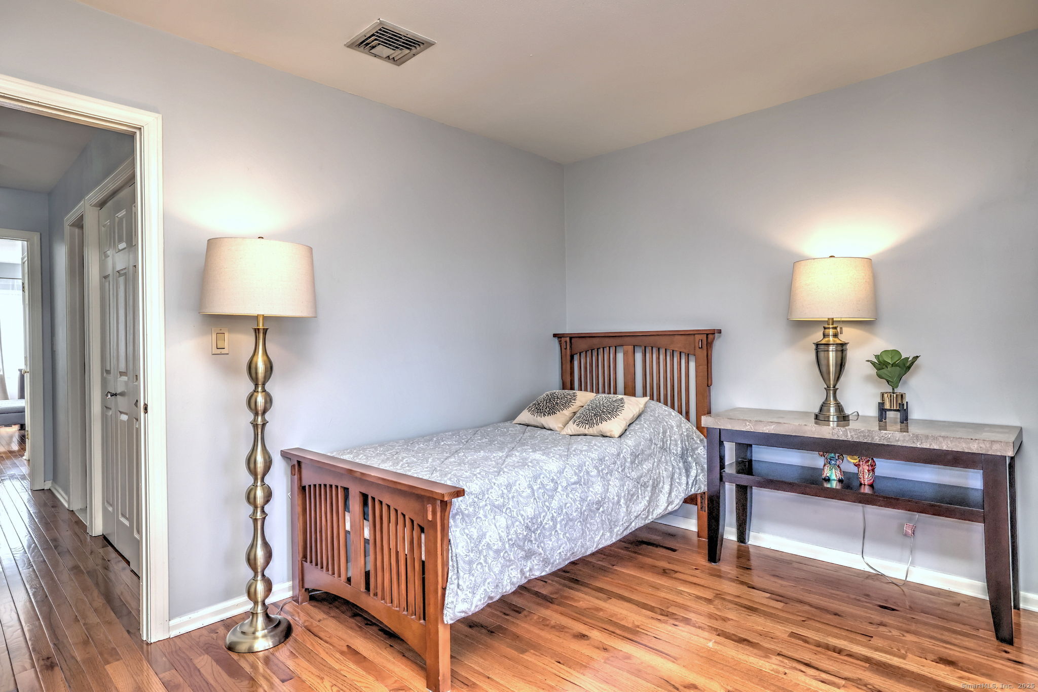 2838 Whitney Avenue, Unit 2 Hamden, CT 06518 - Photo 22 of 26 a bedroom with a bed and a lamp on table