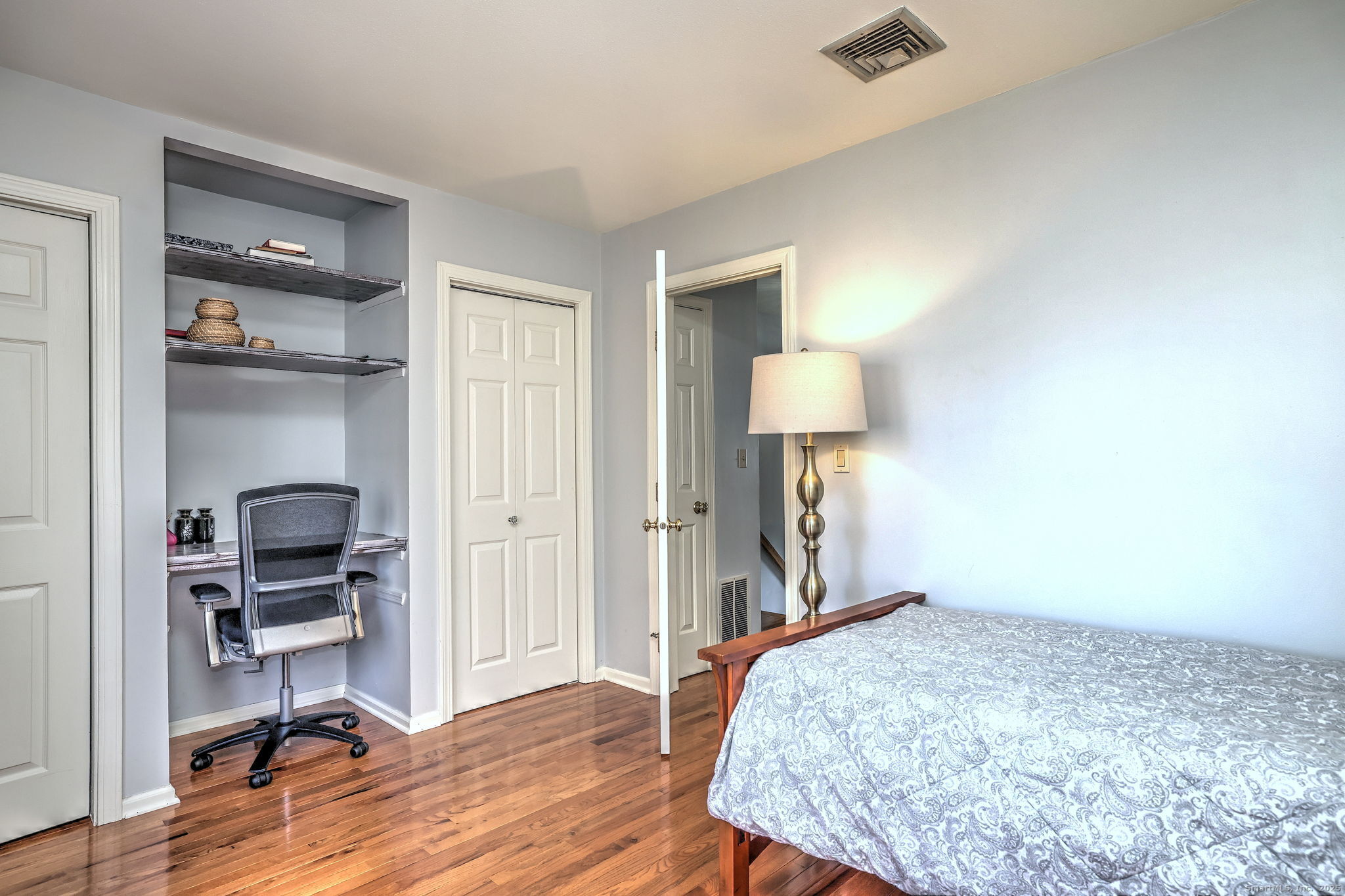 2838 Whitney Avenue, Unit 2 Hamden, CT 06518 - Photo 23 of 26 a bedroom with a bed and a desk in it