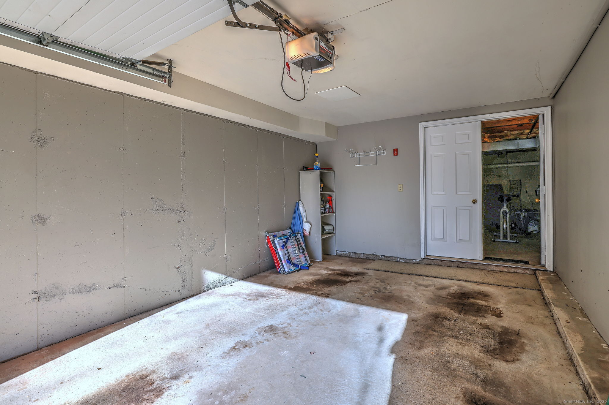 2838 Whitney Avenue, Unit 2 Hamden, CT 06518 - Photo 25 of 26 a view of a room with rack and stairs