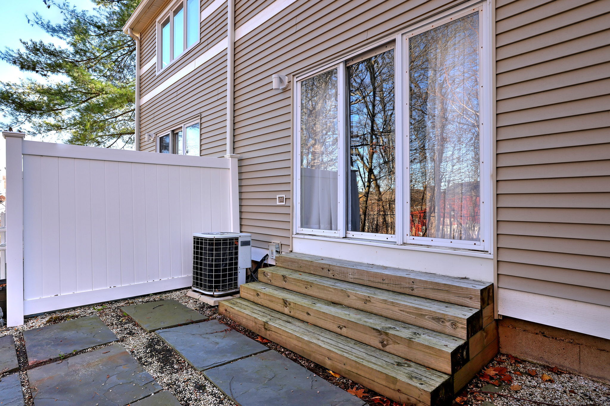 2838 Whitney Avenue, Unit 2 Hamden, CT 06518 - Photo 6 of 26 Spacious outdoor patio ideal for relaxing, dining, and enjoying peaceful moments.