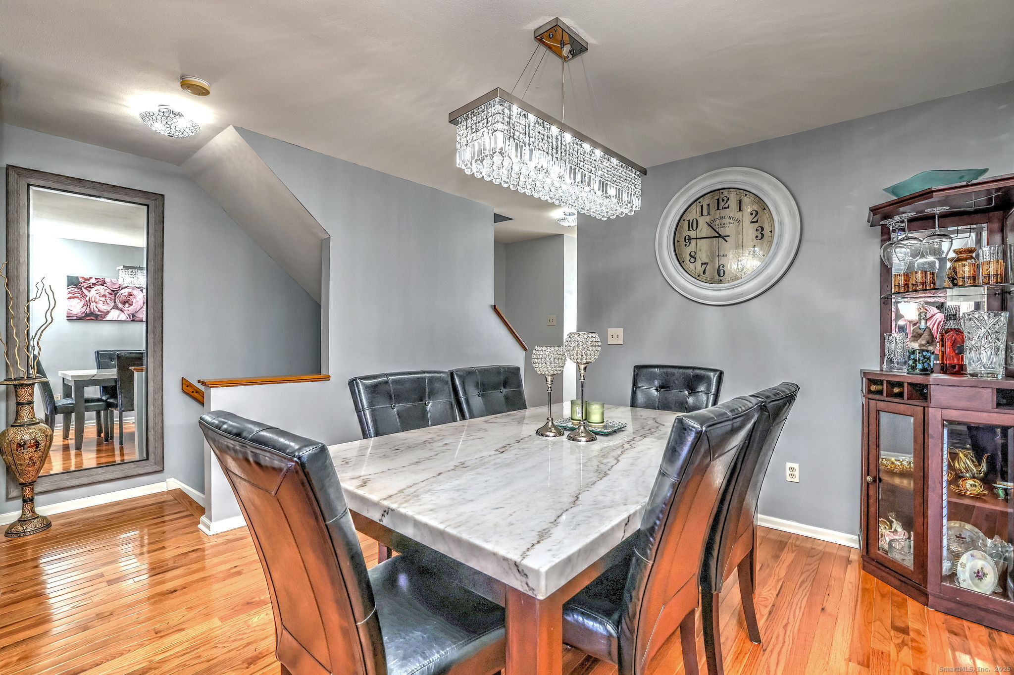 2838 Whitney Avenue, Unit 2 Hamden, CT 06518 - Photo 7 of 26 a view of a dining area with furniture and a chandelier