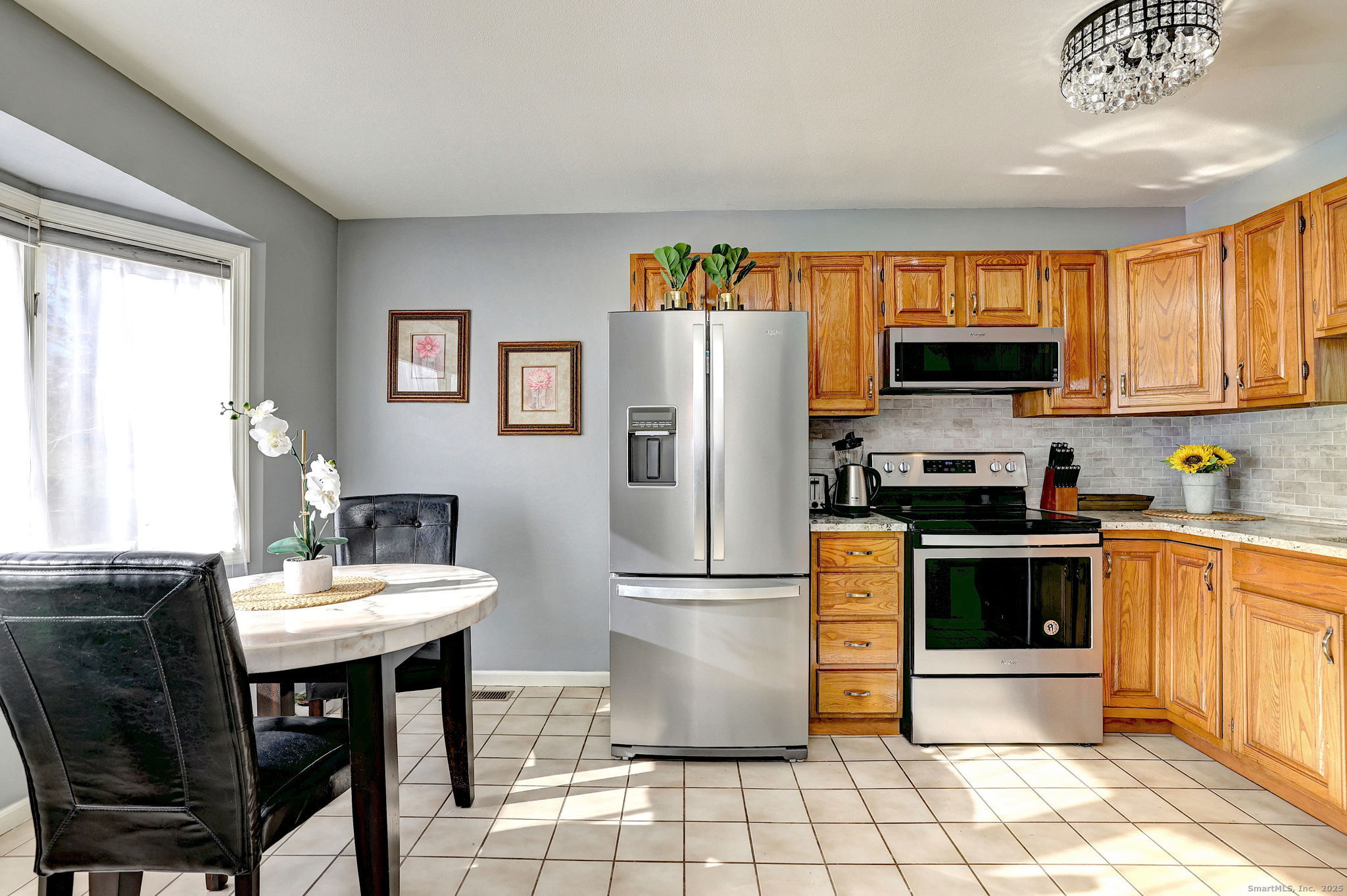 2838 Whitney Avenue, Unit 2 Hamden, CT 06518 - Photo 8 of 26 Bright, comfortable eat-in kitchen that flows directly into the living/dining area.