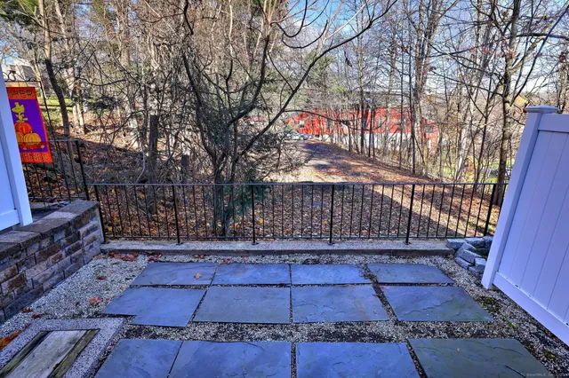 a kitchen with stainless steel appliances granite countertop a refrigerator stove microwave and sink