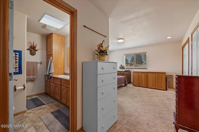 a bathroom with a sink a mirror and a shower