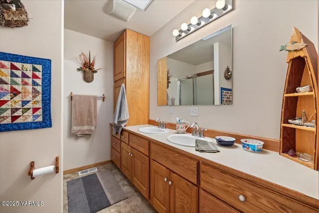 a bedroom with a bed dresser and a window