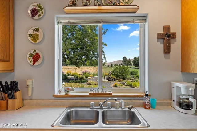 a kitchen with a refrigerator and a window