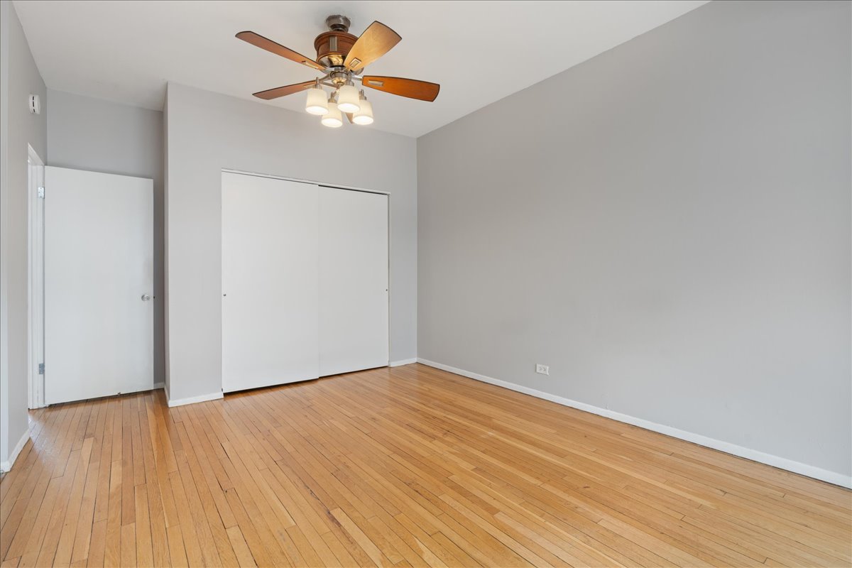 609 West Melrose Street, Unit 2 Chicago, IL 60657 - Photo 12 of 16 a view of an empty room with wooden floor
