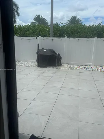 a view of a backyard of the house