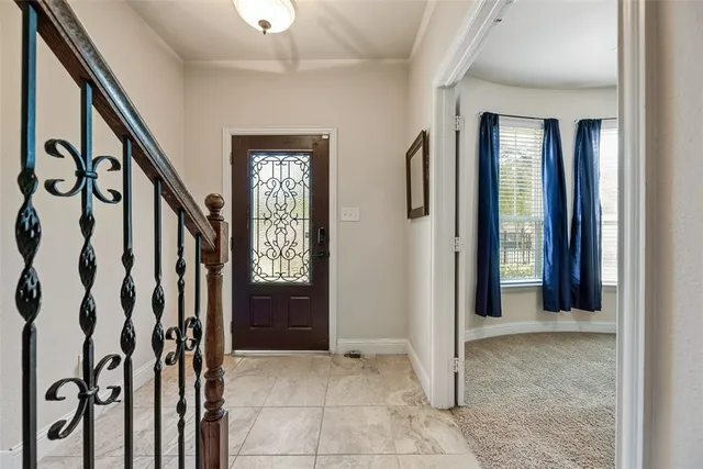a view of an entryway with wooden floor