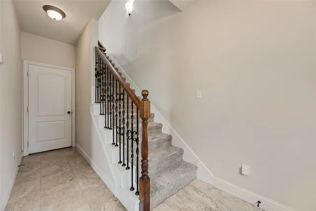 a view of a hallway with staircase