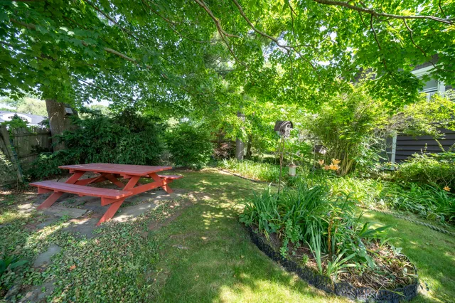 a view of a yard with an outdoor seating