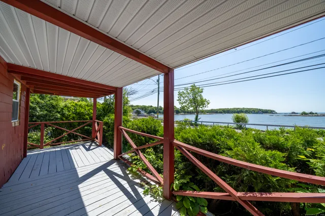 a view of a balcony with wooden floor