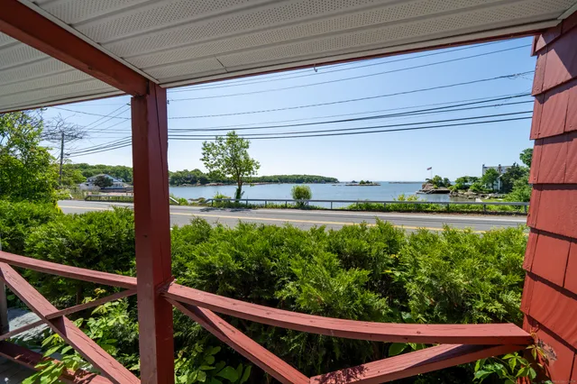 a view of a two chairs in the balcony
