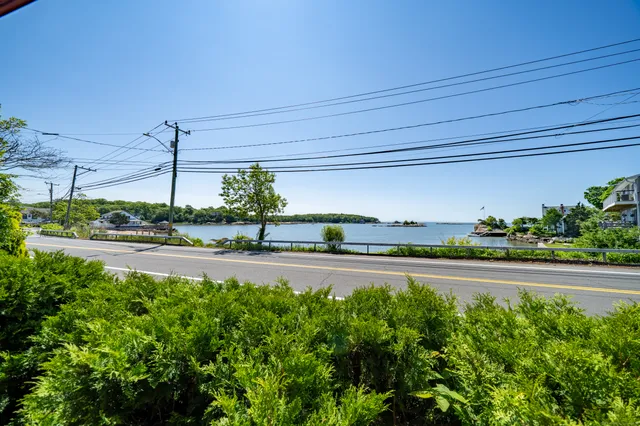 a view of a swimming pool and an outdoor seating