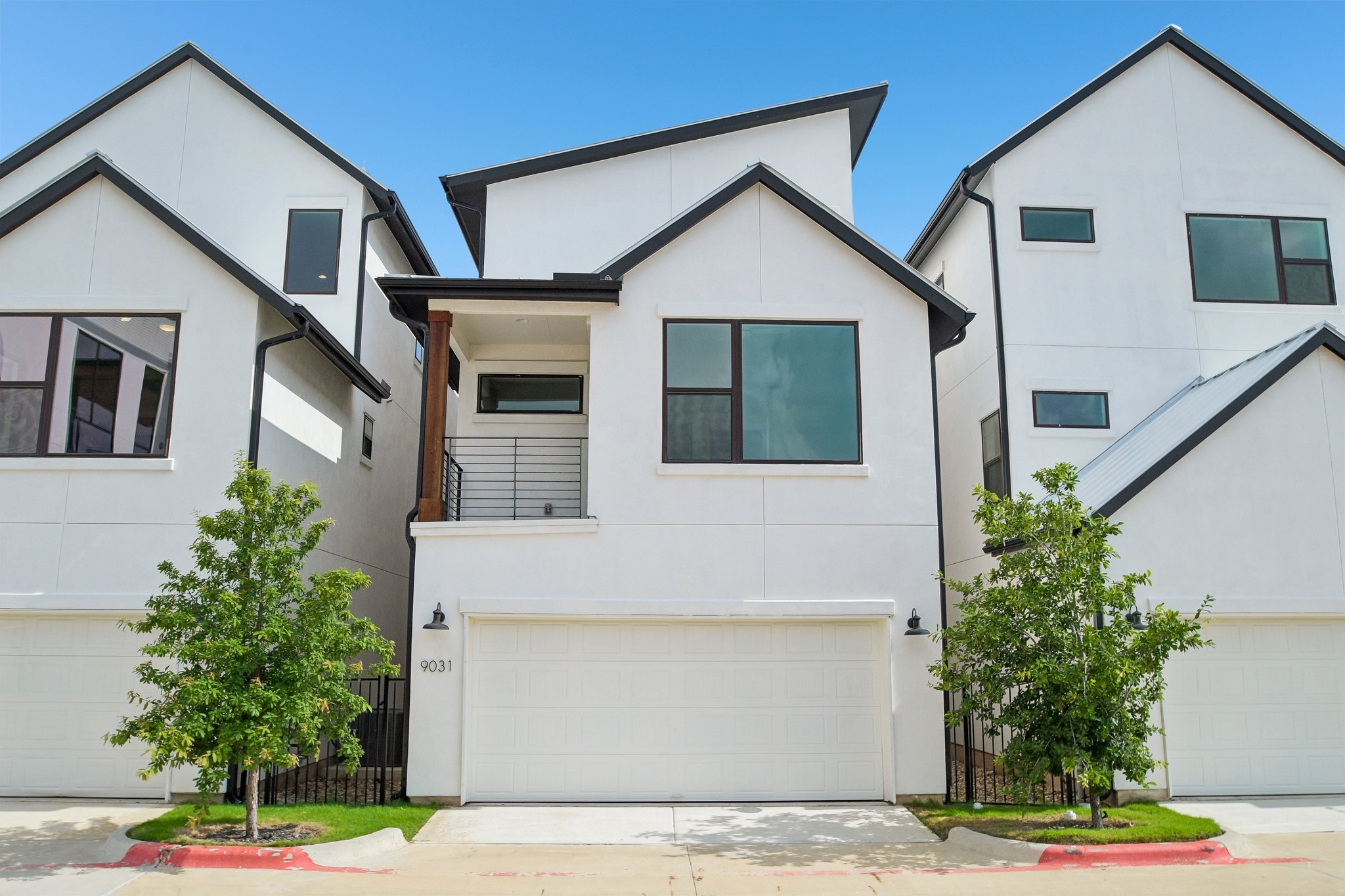 9031 Cattle Baron Path Austin, TX 78747 - Photo 29 of 31 Modern townhome boasts sleek lines and a convenient attached garage.