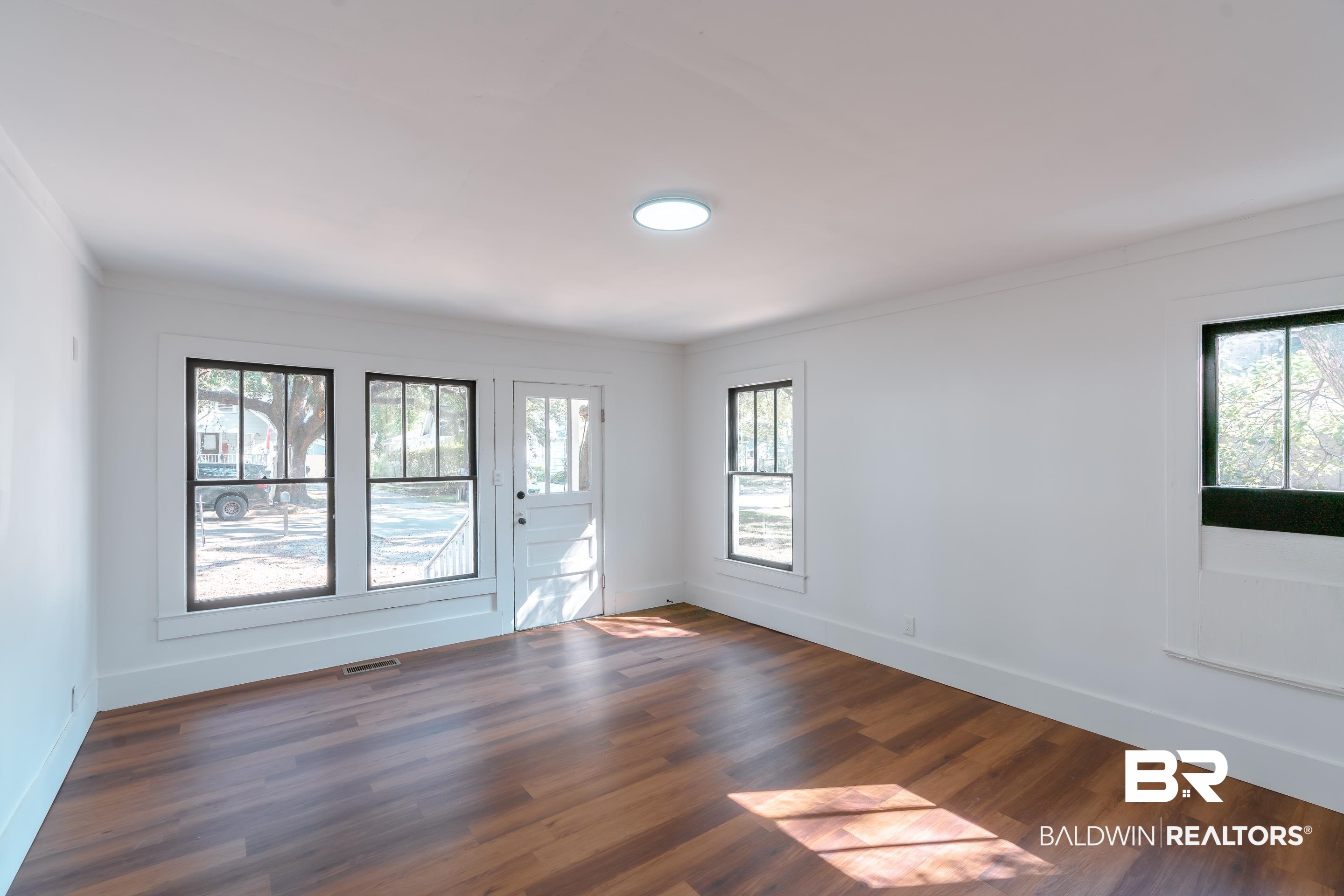 166 Crenshaw Street Mobile, AL 36606 - Photo 8 of 24 Spare room with crown molding and dark hardwood / wood-style flooring
