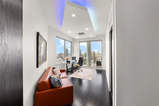 a large bathroom with a tub a sink and a large mirror