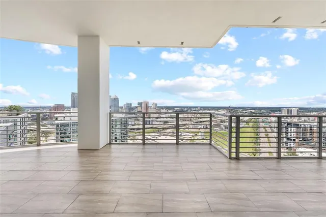 a bedroom with a bed wooden floor and furniture