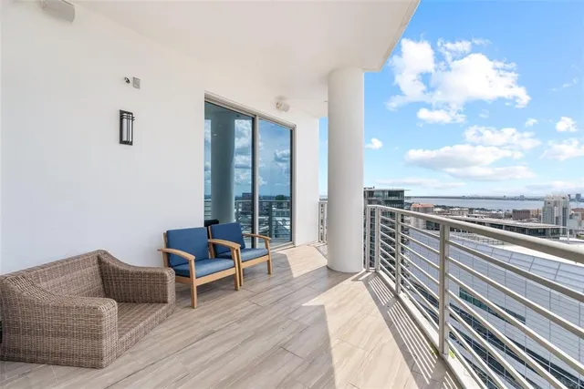 a bathroom with a sink a toilet a mirror and shower