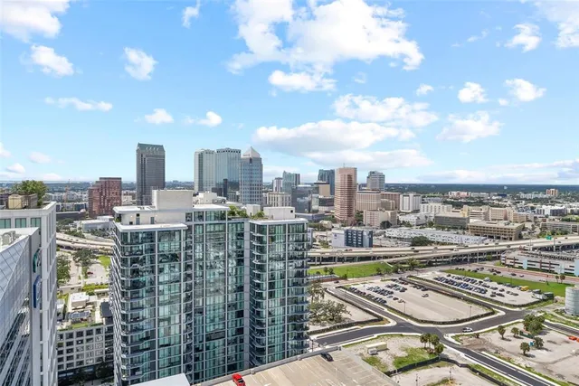a bedroom with a bed and a lamp