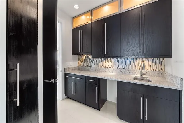 an aerial view of a house with garden space swimming pool and outdoor seating