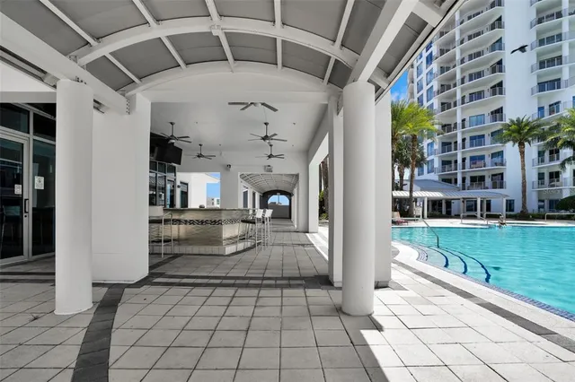 a living room with furniture wooden floor and a view of kitchen