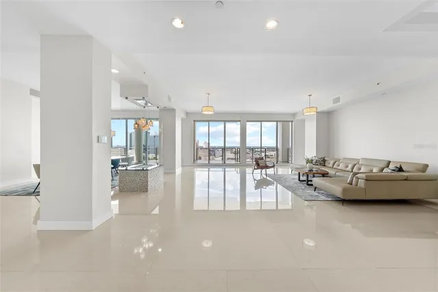 a kitchen with kitchen island granite countertop a sink and cabinets