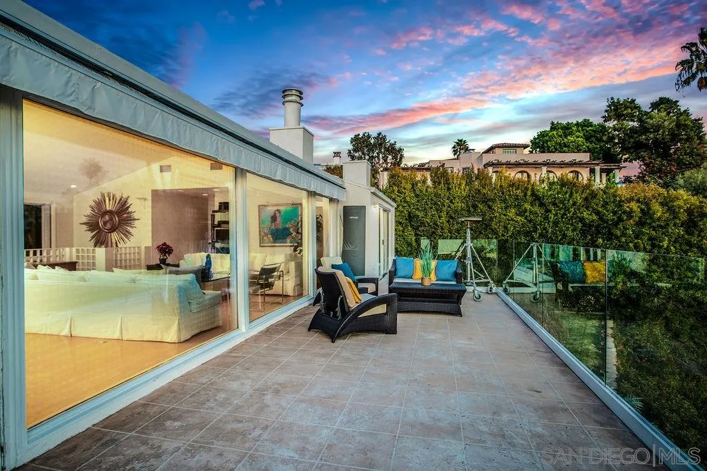 925 Havenhurst Drive La Jolla, CA 92037 - Photo 16 of 17 a view of a patio with table and chairs and potted plants