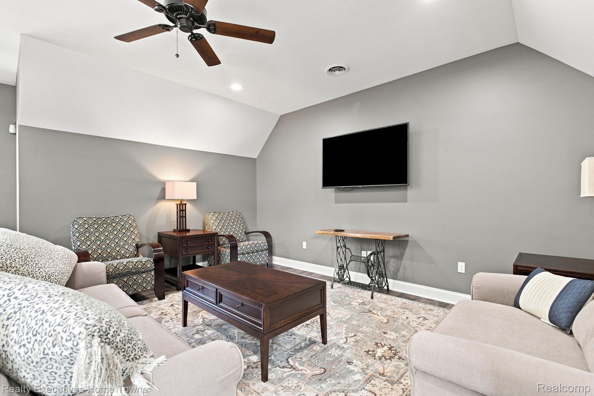 2829 Riverside Drive Port Huron, MI 48060 - Photo 32 of 99 Vaulted ceiling with a wood-finish ceiling fan and recessed lighting