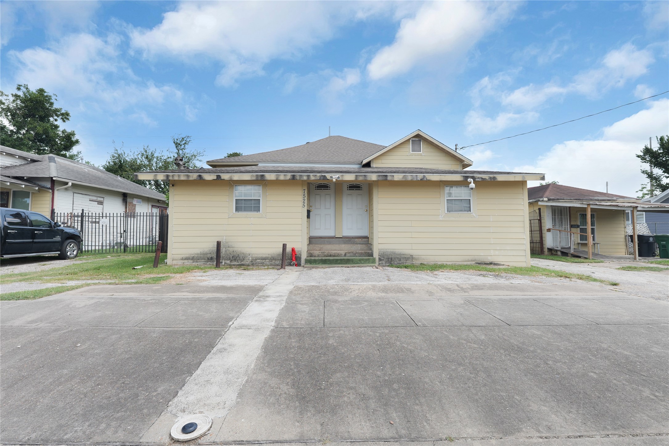 7525 Canal Street Houston, TX 77012 - Photo 1 of 18 a front view of a house with a yard and garage