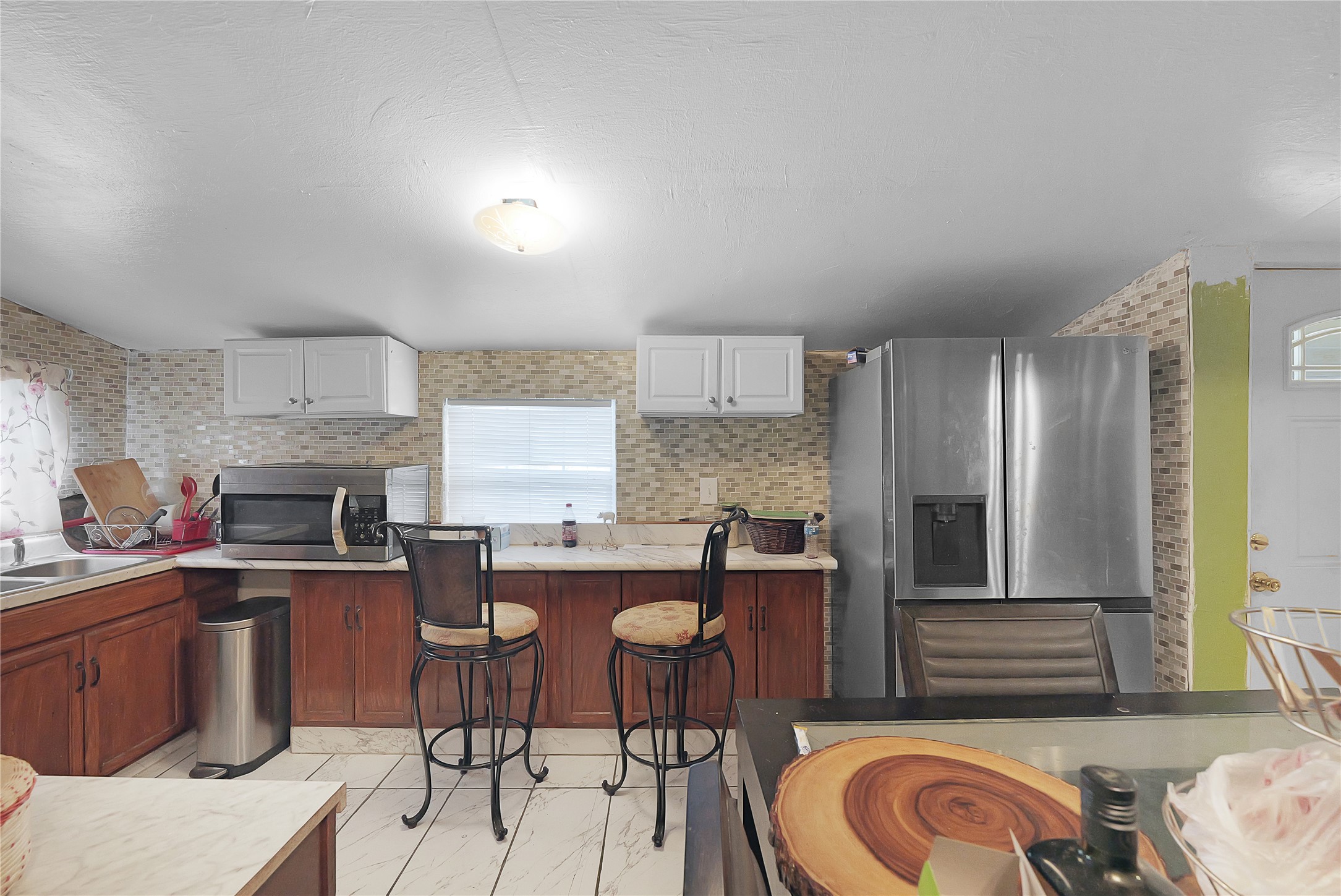 7525 Canal Street Houston, TX 77012 - Photo 8 of 18 a kitchen with granite countertop a sink stove and cabinets