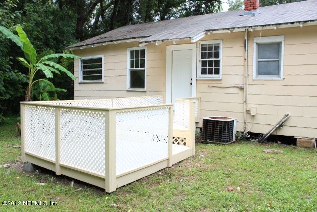 4525 Sunderland Road Jacksonville, FL 32210 - Photo 16 of 35 a view of a house with a yard