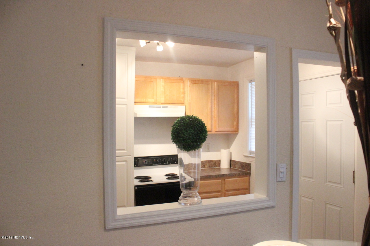 4525 Sunderland Road Jacksonville, FL 32210 - Photo 2 of 35 a bathroom with a sink and a window