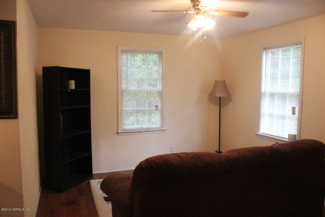 4525 Sunderland Road Jacksonville, FL 32210 - Photo 24 of 35 a bedroom with a bed and a window