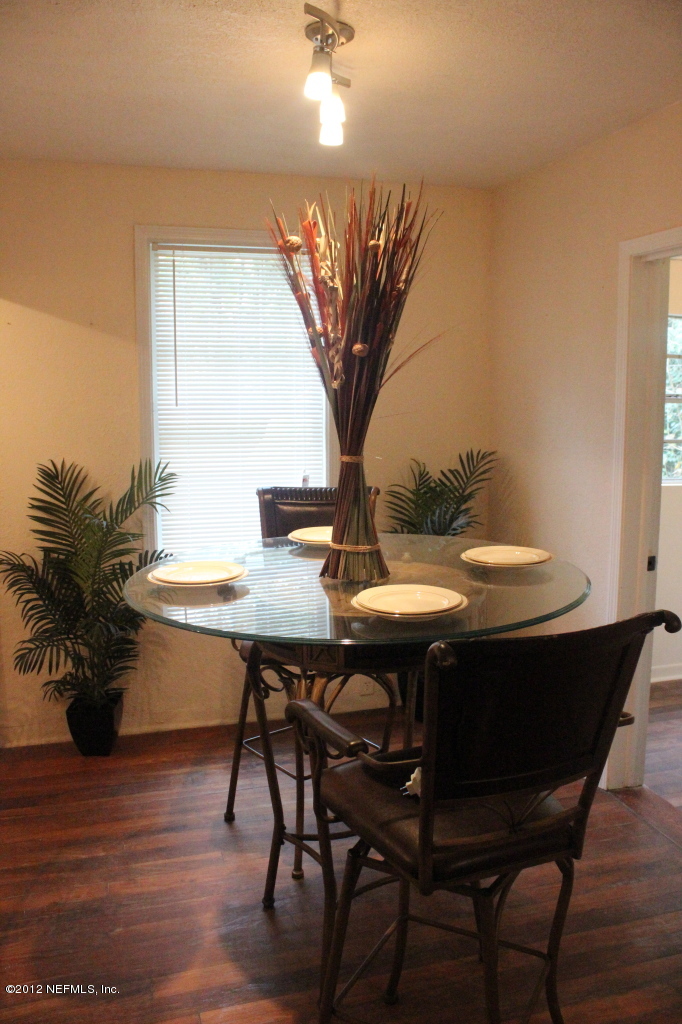 4525 Sunderland Road Jacksonville, FL 32210 - Photo 3 of 35 a view of a dining room with furniture and wooden floor