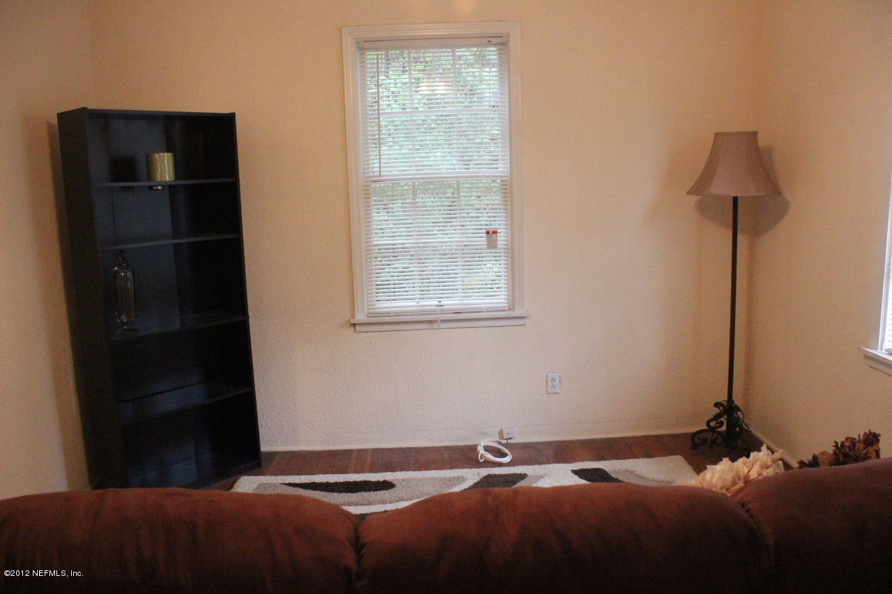 4525 Sunderland Road Jacksonville, FL 32210 - Photo 4 of 35 a bedroom with a bed and a window