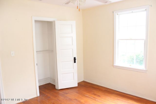 4525 Sunderland Road Jacksonville, FL 32210 - Photo 5 of 35 a view of an empty room with wooden floor