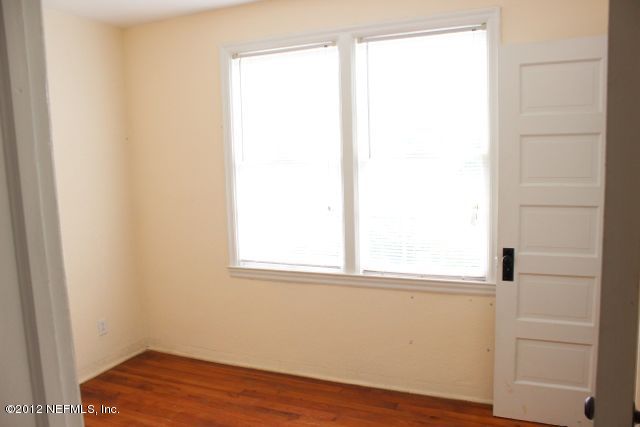 4525 Sunderland Road Jacksonville, FL 32210 - Photo 6 of 35 a view of a small space with wooden floor and a window