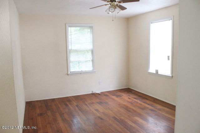 4525 Sunderland Road Jacksonville, FL 32210 - Photo 7 of 35 an empty room with a window