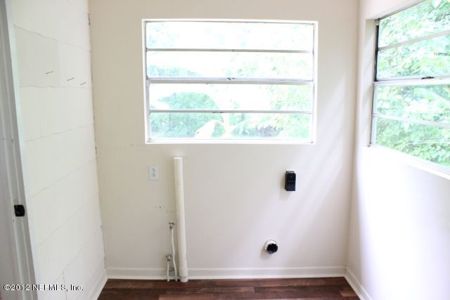 4525 Sunderland Road Jacksonville, FL 32210 - Photo 9 of 35 a view of a small space with wooden floor and a window