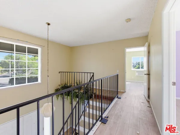 a view of a hallway with windows