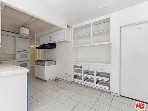 a view of storage and utility room with washer and dryer