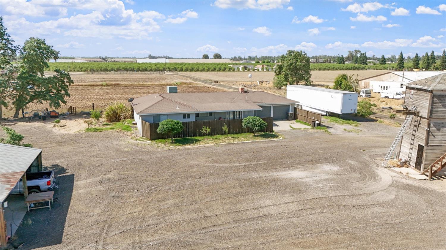 18365 East Clausen Road Turlock, CA 95380 - Photo 16 of 28 a view of a city street with a building in the background