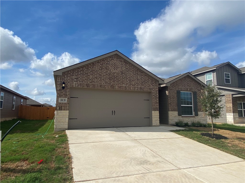 113 Declaration Lane Liberty Hill, TX 78642 - Photo 2 of 22 a house view with a backyard space