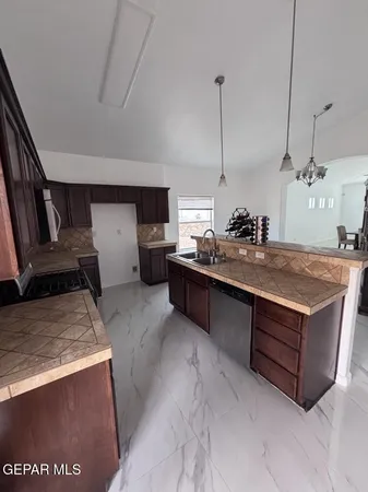 a kitchen with a stove and a microwave