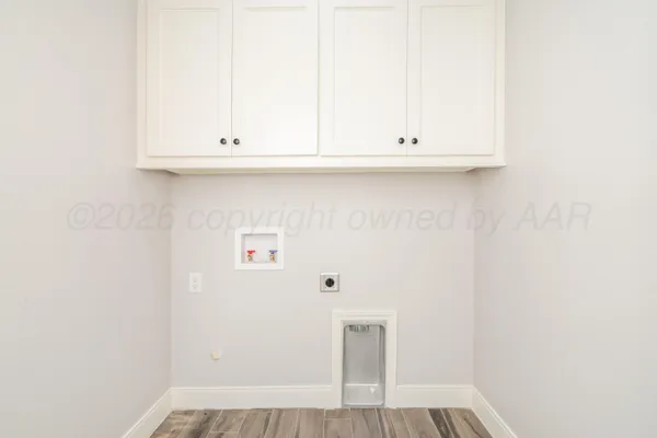 a view of kitchen with white cabinets