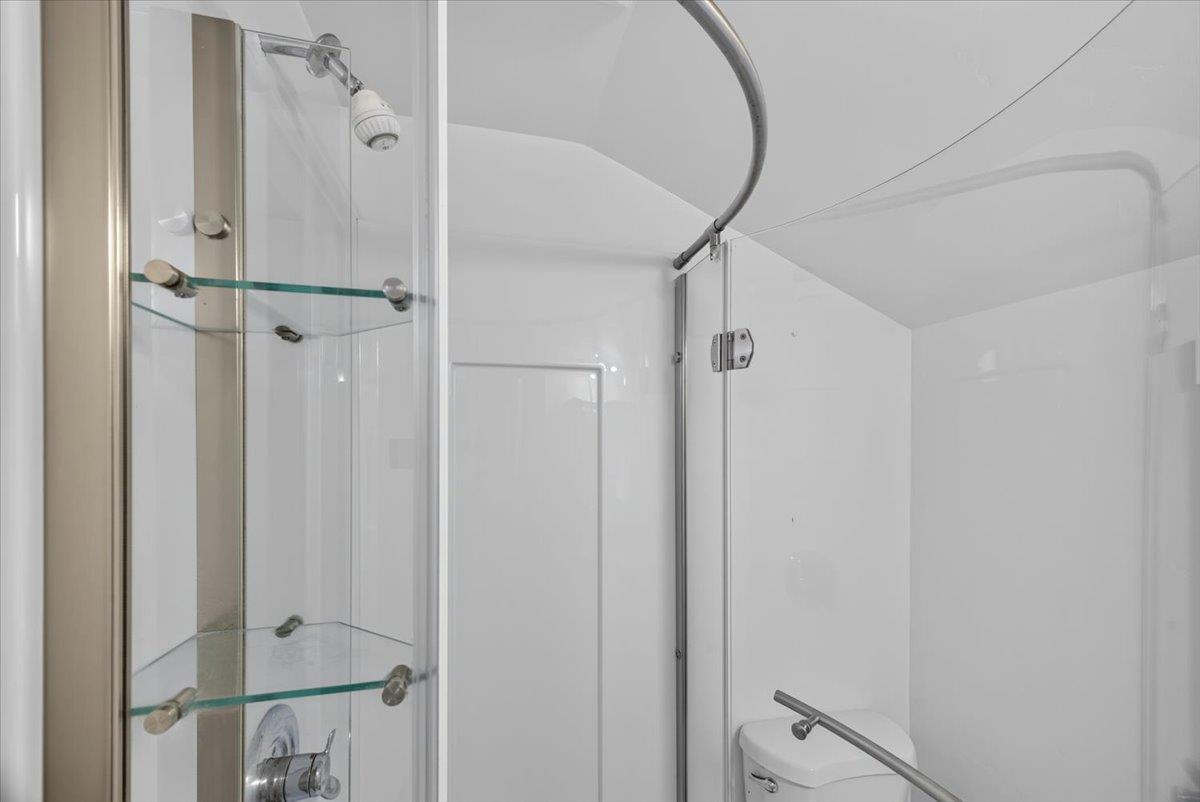 514 Primavera Road Boulder Creek, CA 95006 - Photo 40 of 40 a bathroom with a shower and a mirror