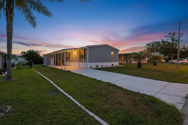 a view of a house with a big yard